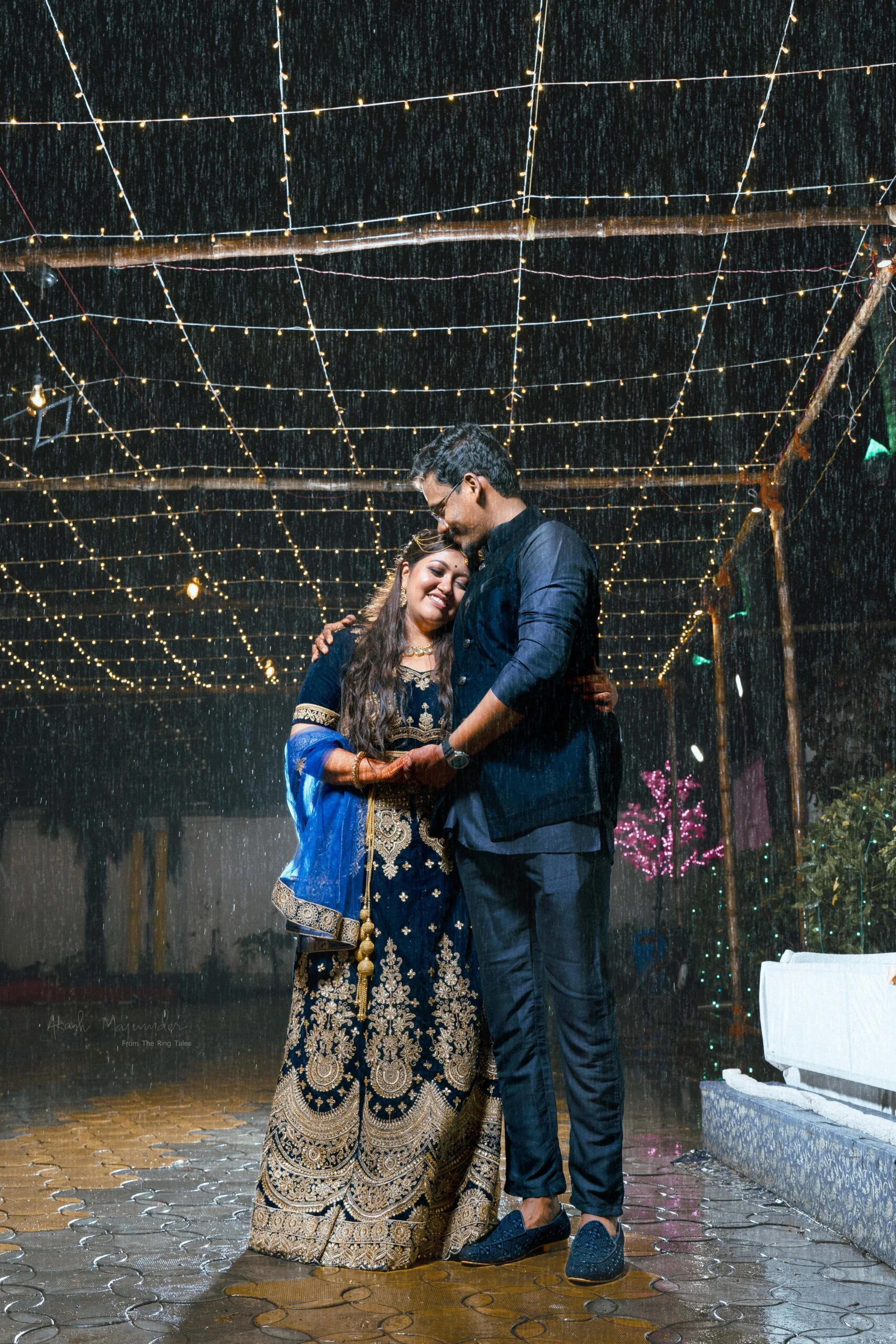 Choose the best wedding photographer to capture Couple portrait photo in rain