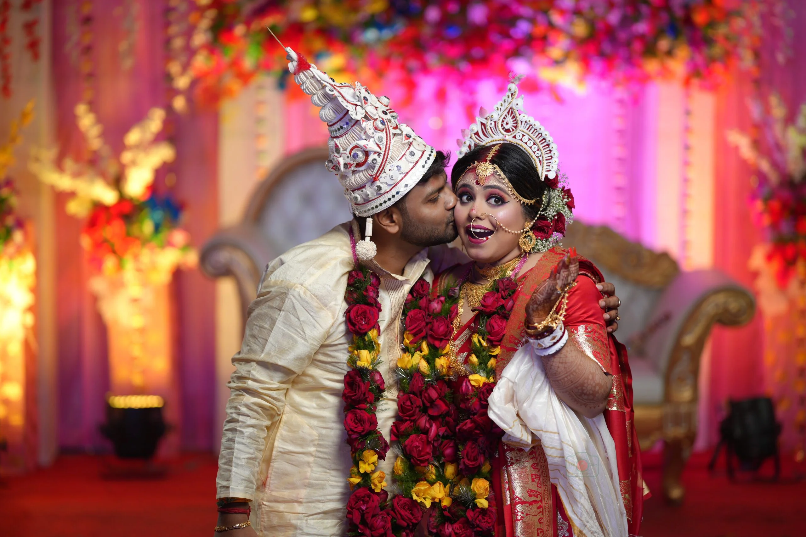 bride gets surprise by husbands sudden kiss
